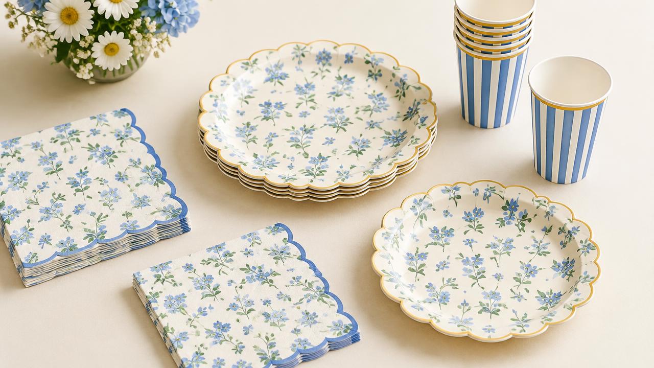 Blue floral scalloped paper plates, napkins and striped cups